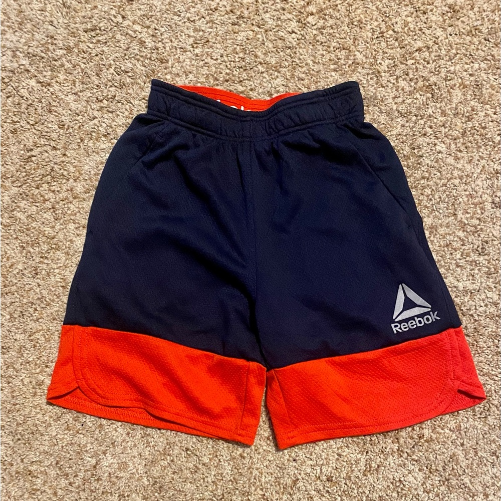 Boys XS Reebok athletic shorts. Navy blue and red.